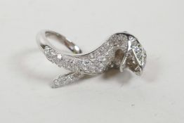 A 925 silver and cubic zirconium encrusted ring in the form of a cobra, approximate size 'O'