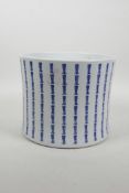 A Chinese blue and white porcelain brush pot with all over character inscription decoration, 6½"