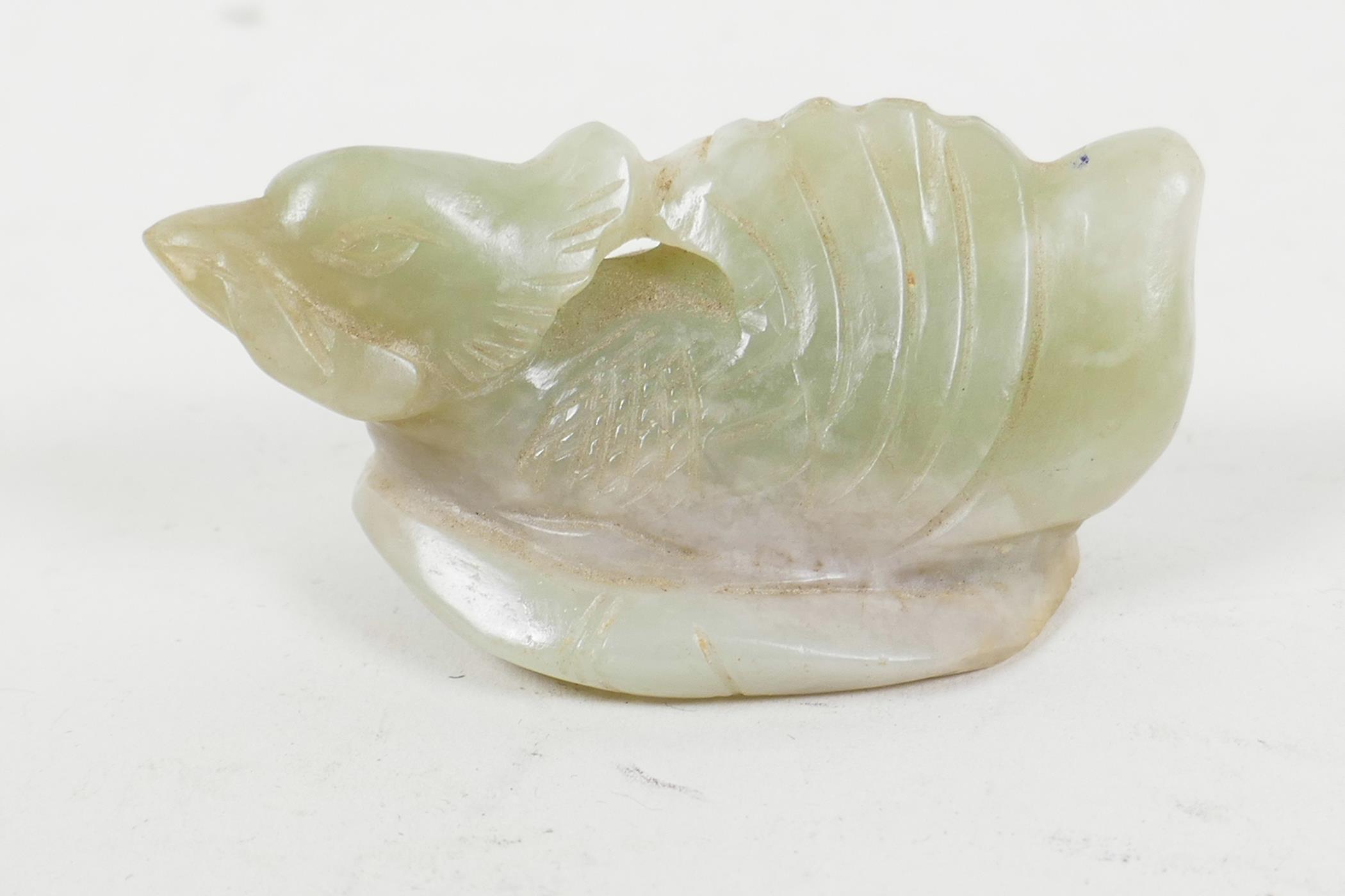 A small Chinese carved jade figure of a duck, 2¼" long