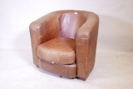 A brown leather club chair, 31" high