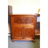 A C19th continental secretaire abattant with burr walnut panels, the fall front fitted with an