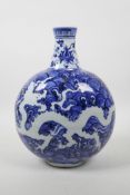 A Chinese blue and white porcelain moon flask with dragon decoration, incised character marks to