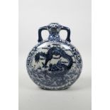 A Chinese blue and white porcelain two handled moon flask, decorated with dragons above waves,