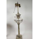 A silver plate and glass table lamp in the form of an oil lamp with classical column base and