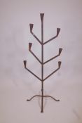 A wrought iron floor standing seven branch candelabra, 45" high