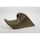 An Ottoman bronze stirrup with raised laurel decoration, 10½" long