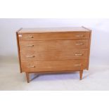 A mid century chest of four long drawers by John Herbert for A. Younger, handles replaced, 42½" x