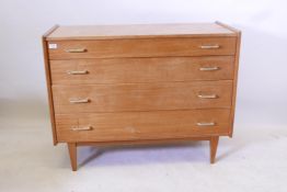 A mid century chest of four long drawers by John Herbert for A. Younger, handles replaced, 42½" x