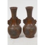 A pair of Japanese patinated antimony bottle vases with applied floral decoration, 3½" high