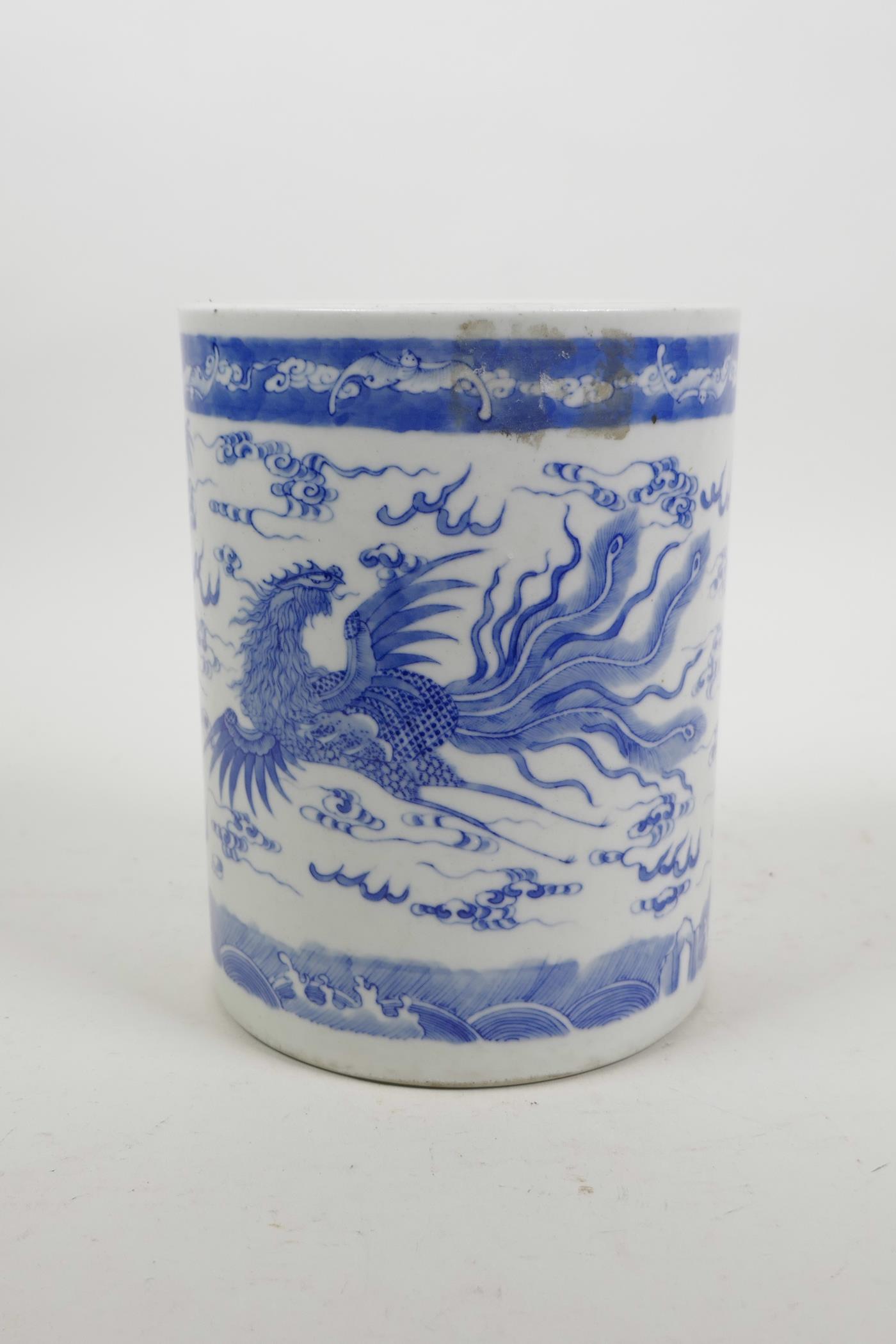 A Chinese blue and white porcelain brush pot decorated with a dragon and phoenix chasing the flaming - Image 3 of 5