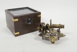 A reproduction brass sextant, boxed, 4½" x 4½"