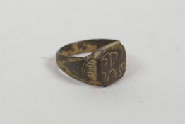 A bronze Viking style ring with engraved inscription