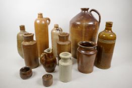 A collection of stoneware bottles, jars and large flagon, flagon 13" high