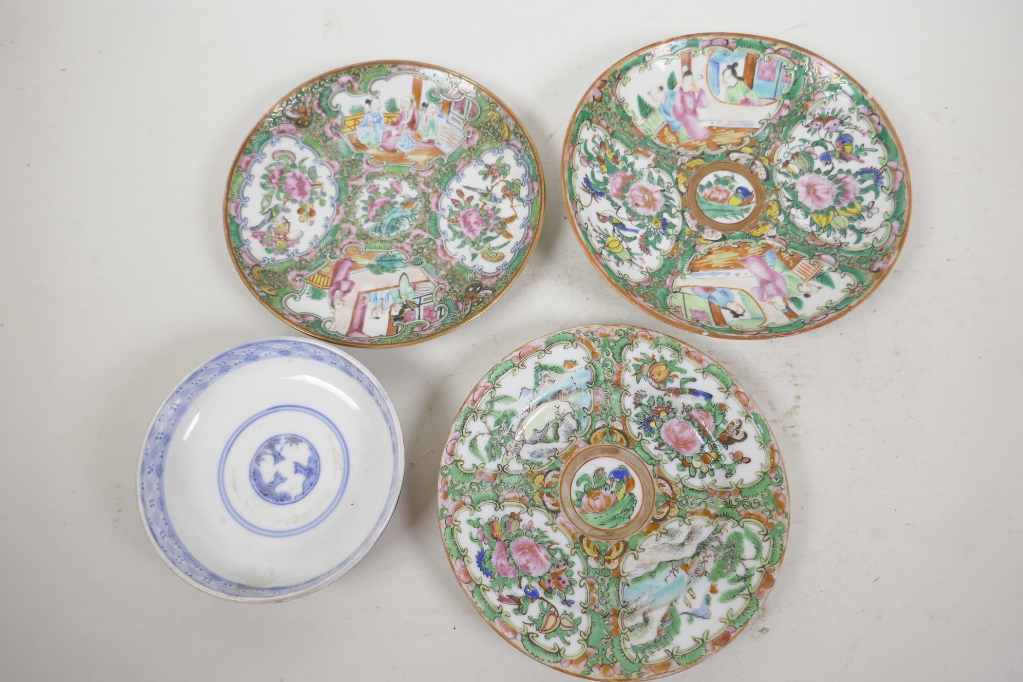 Three Canton famille rose saucer dishes painted with panels of figures and flowers, largest 6½"