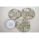 Three Canton famille rose saucer dishes painted with panels of figures and flowers, largest 6½"