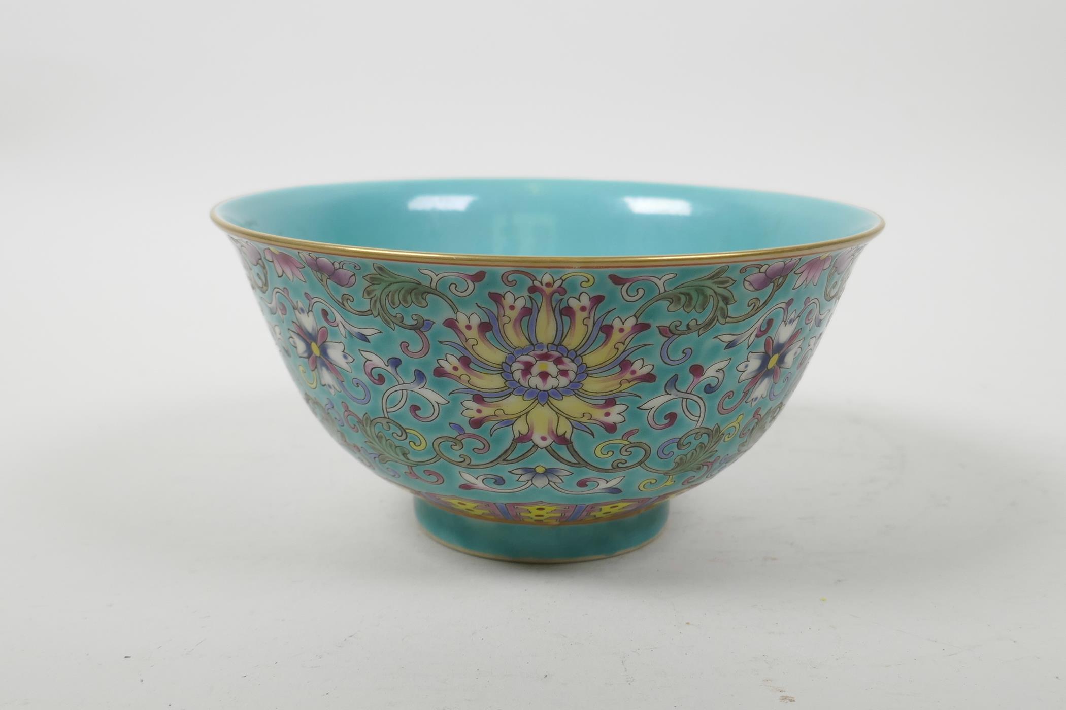 A Chinese polychrome porcelain rice bowl with enamelled scrolling lotus flower decoration, seal mark - Image 2 of 5