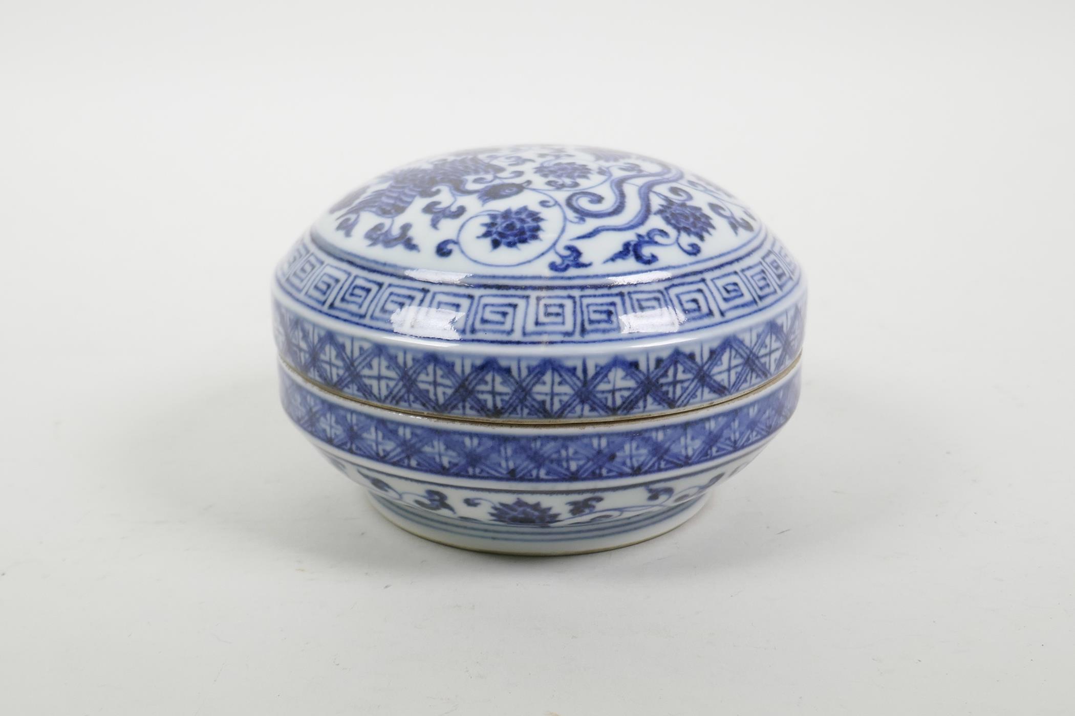 A Chinese blue and white porcelain box and cover, decorated with phoenix and lotus flowers, 6