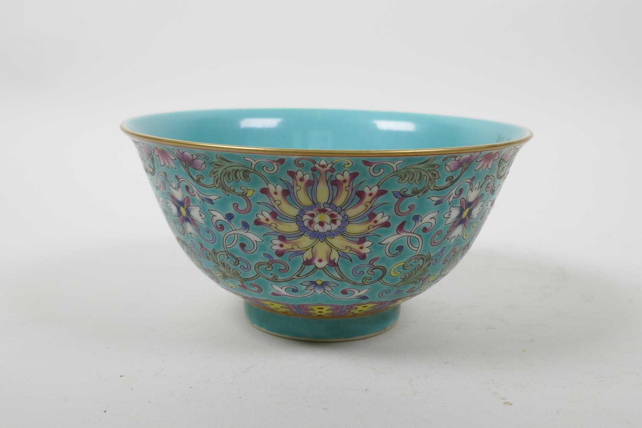A Chinese polychrome porcelain rice bowl with enamelled scrolling lotus flower decoration, seal mark - Image 4 of 5