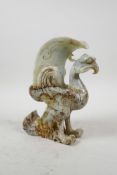 A Chinese carved jade phoenix shaped brush holder, 8½" high