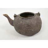 An Oriental gilt bronze teapot with dimpled decoration, no lid, 6½" long