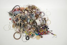 A large quantity of costume jewellery including bangles, necklaces, earrings etc