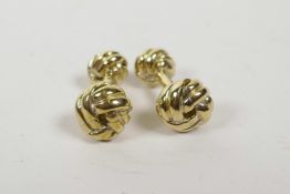 A pair of gold plated cufflinks in the form of knots