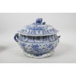 A Chinese blue and white porcelain two handled tureen and cover with floral decoration, 10½" x 9",