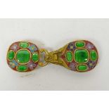 A gilt and cloisonne belt buckle in the form of a dragon set with green stones, 4" long
