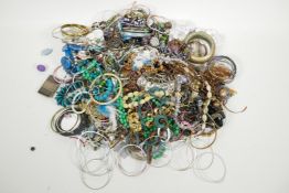 A large quantity of costume jewellery including bangles, necklaces, earrings etc