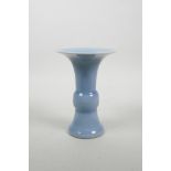 A Chinese light blue glazed porcelain Gu vase, seal mark to base, 7" high