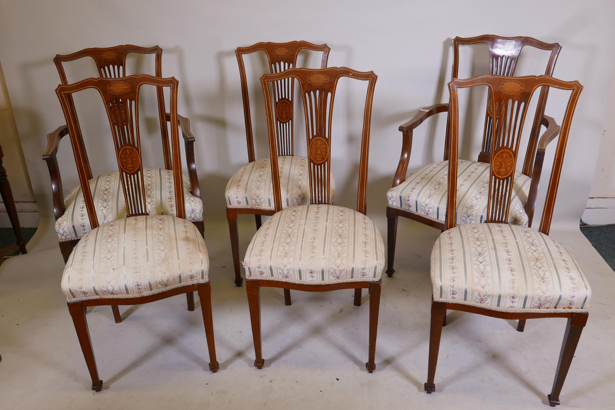 A set of Victorian inlaid mahogany parlour chairs comprising two elbow and four standard chairs