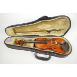 An 1/8th size student violin by Bankeri, 17" long, comes with bow in fitted hard case