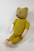 An early C20th humpback teddy bear, 23" long