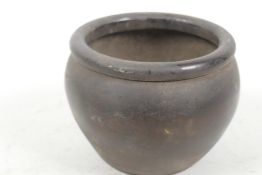 A small Chinese bronze jar, 3½" high, 4" diameter