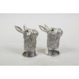 A pair of silver plated condiments in the form of hares, 2½"