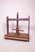 A vintage walnut book press marked NGSL maker and numbered 16674, 24" high, 24½" wide