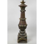 A turned oak column table lamp of classical form with carved and gilded embellishments, 22" high