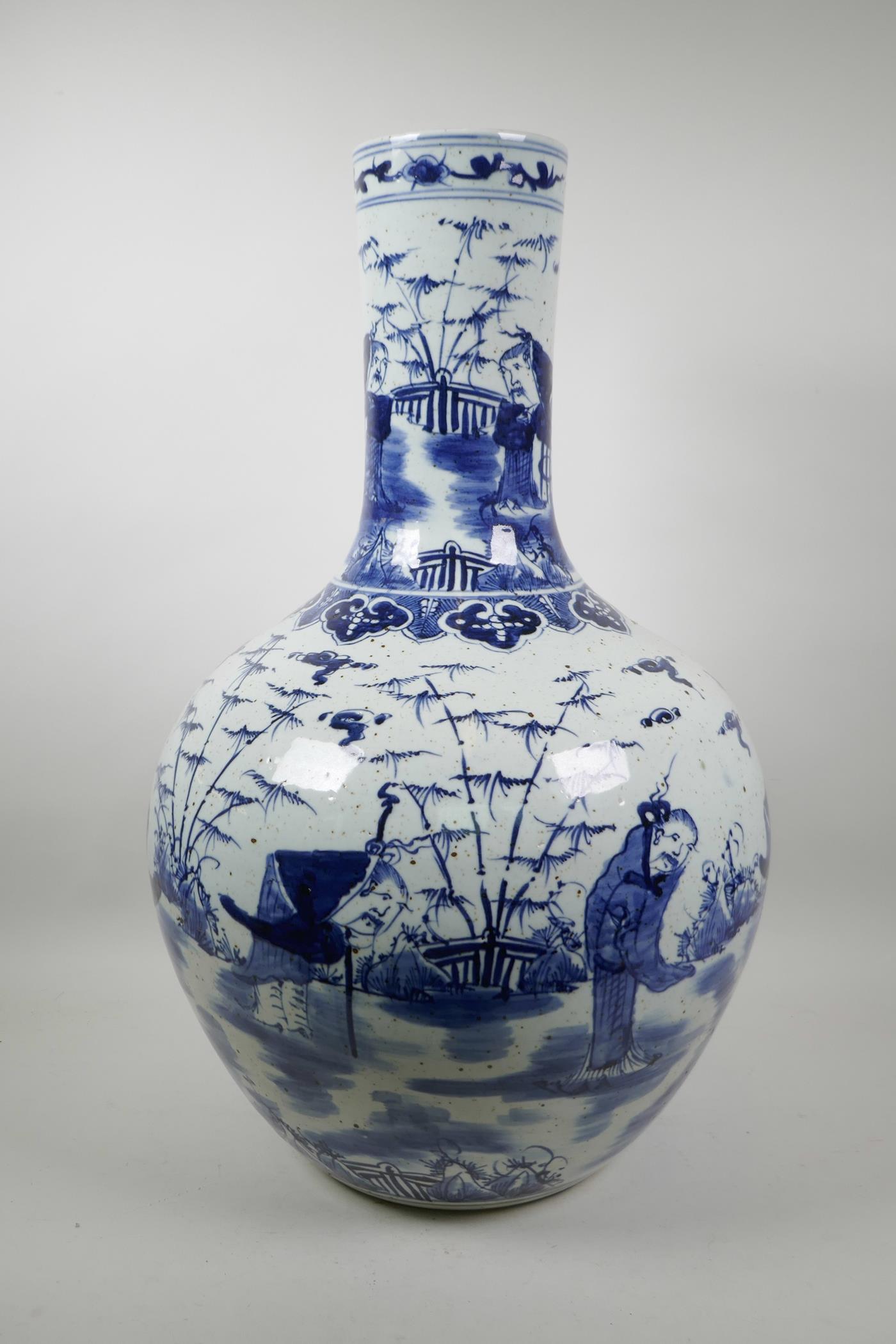 A large Chinese blue and white pottery bottle vase decorated with old bearded men in a garden, 23"