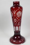 A Bohemian flash cut red over clear glass lamp base, 15" high