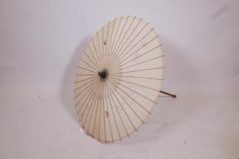 A Japanese bamboo and silk parasol, with embroidered butterfly and floral decoration, 33" long x 31"