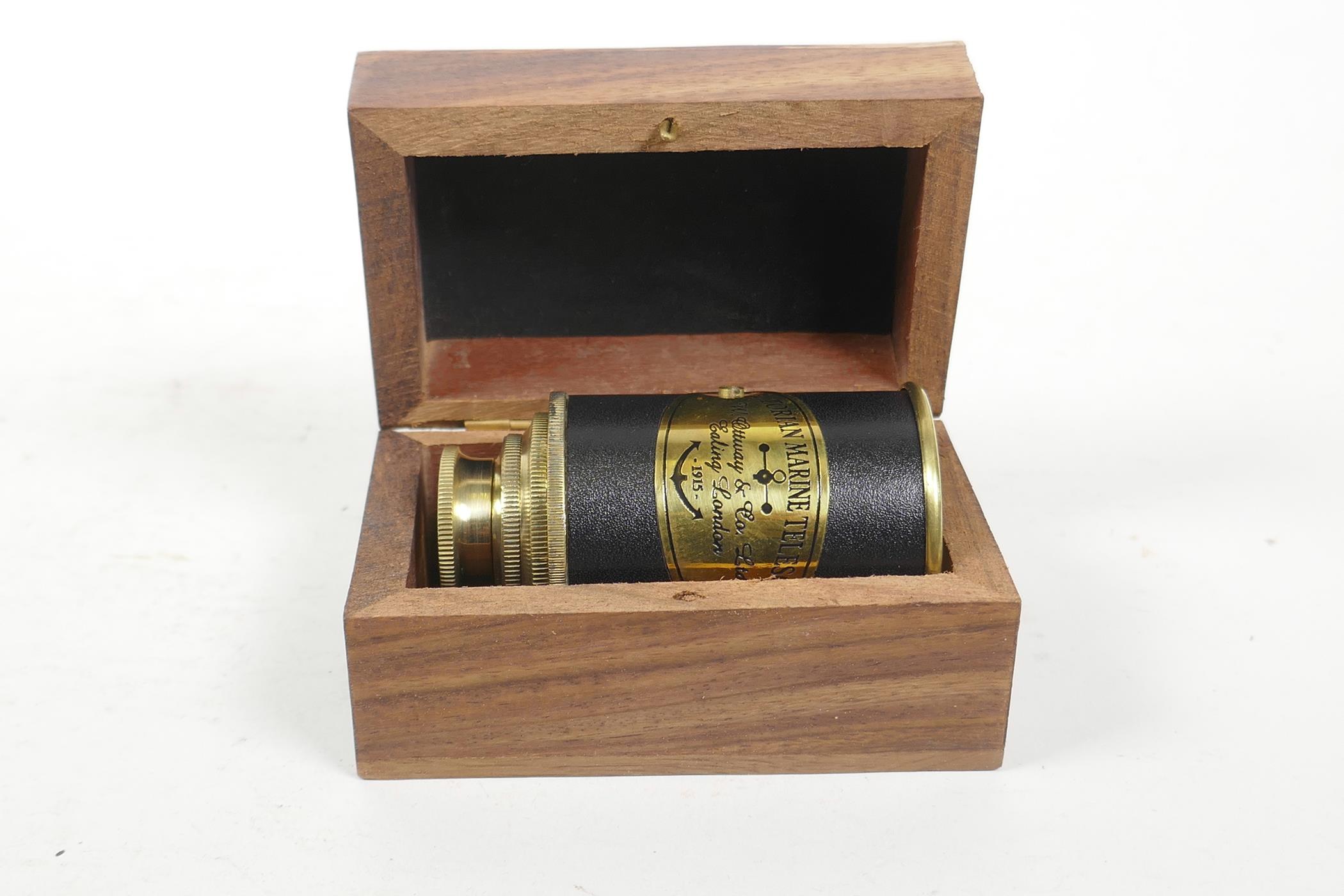 A reproduction brass 'Victorian Marine Telescope', boxed, 3½" x 2½"