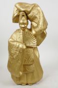 A gilt metal figure of a Japanese Noh actor dressed as a Shinto priest, 13½" high