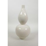 A Chinese cream ground porcelain double gourd vase with incised floral decoration, 11" high