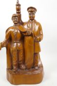 A Chinese Republic carved wood figure of two men, one with gun, 16" high