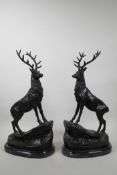 A pair of bronzed metal stags after J. Moigniez, 17" high