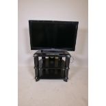 A Panasonic Viera 32" television, and a TV stand