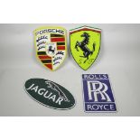 Four painted cast metal plaques of automotive interest, 7½" x 11½"