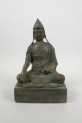 A Tibetan bronze of Buddha seated in meditation, 9" high