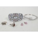 A small collection of costume jewellery including two rings, a cubic zirconium bangle etc