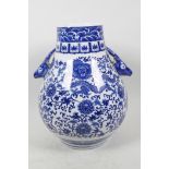 A Chinese blue and white porcelain vase of bulbous form with two deer head handles, decorated with